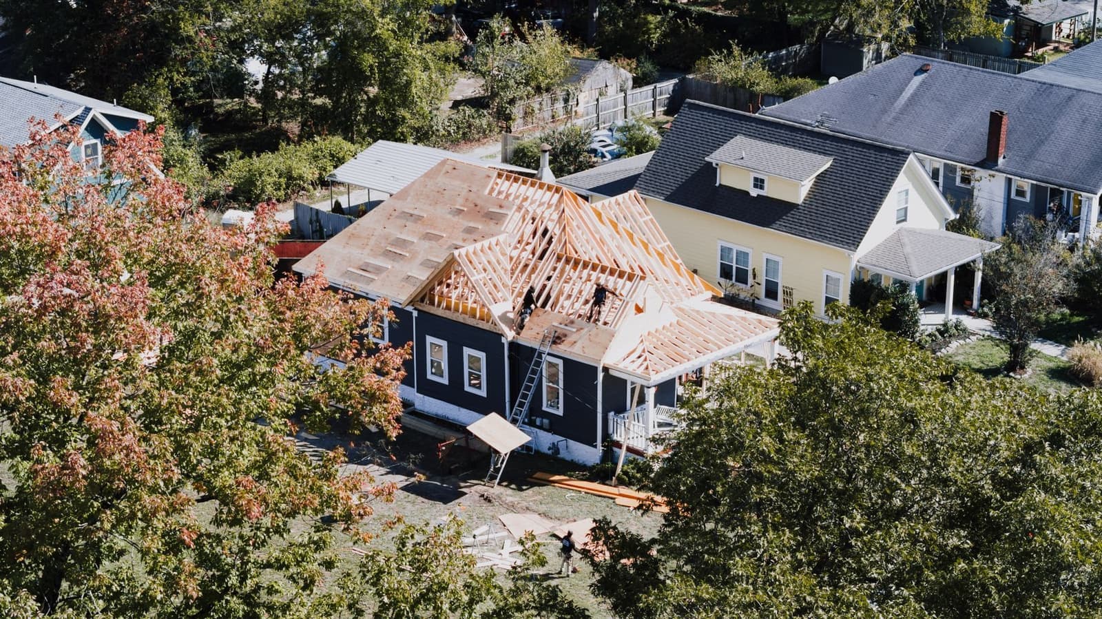 Aerial view of a house roof being stripped