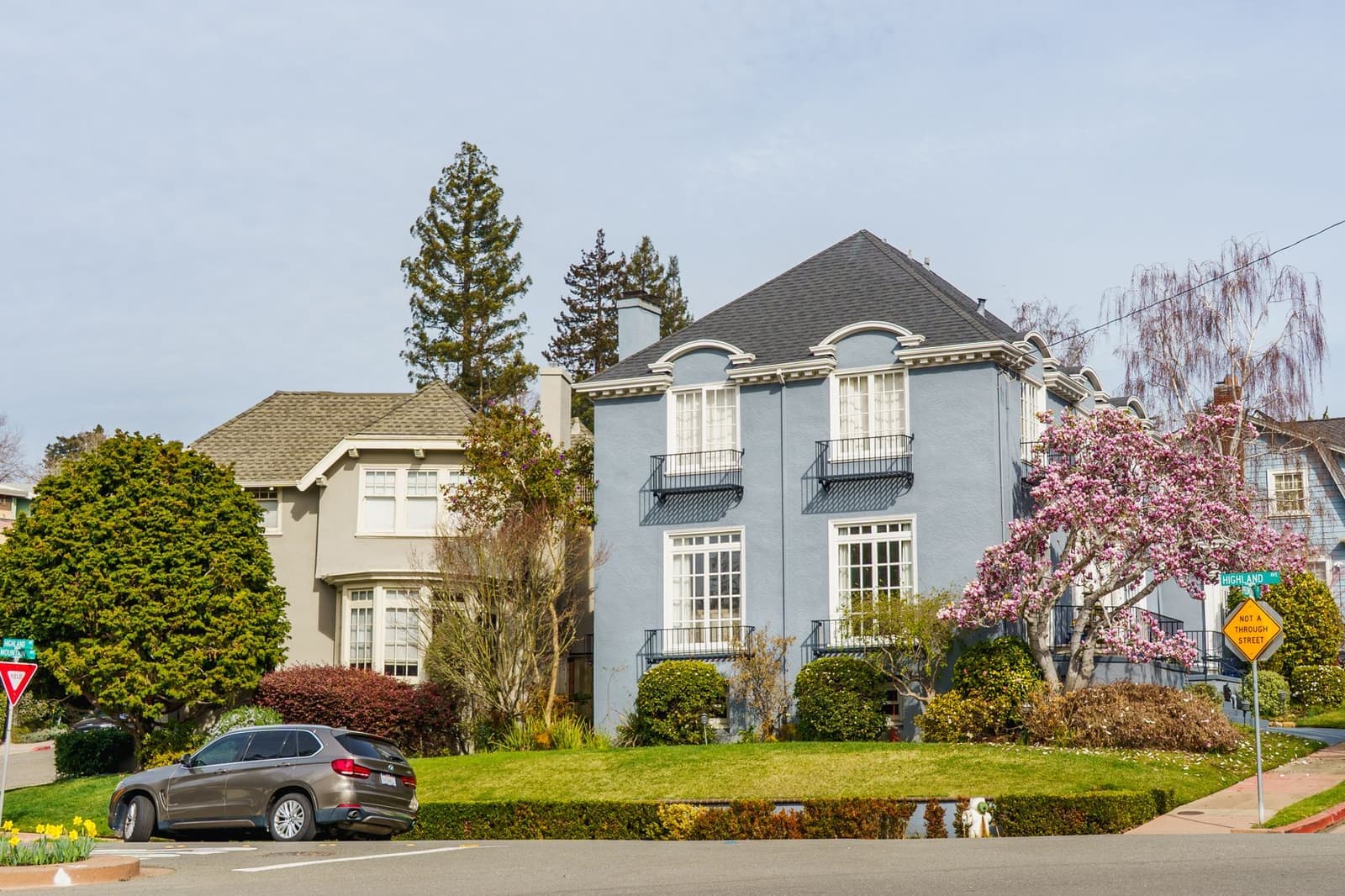 Blue two-story house with shingle roof