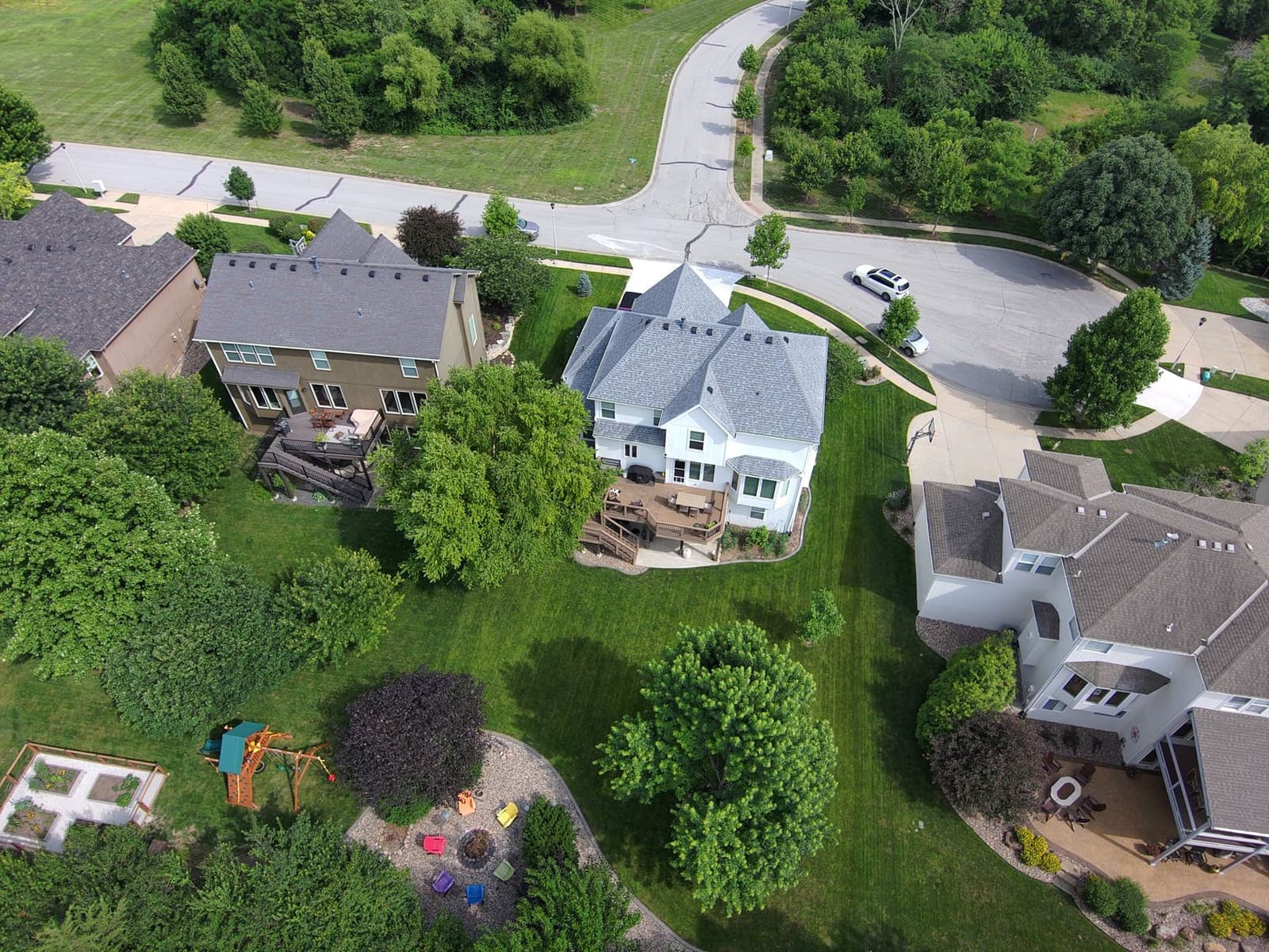 Aerial view of homes with shingle roofs
